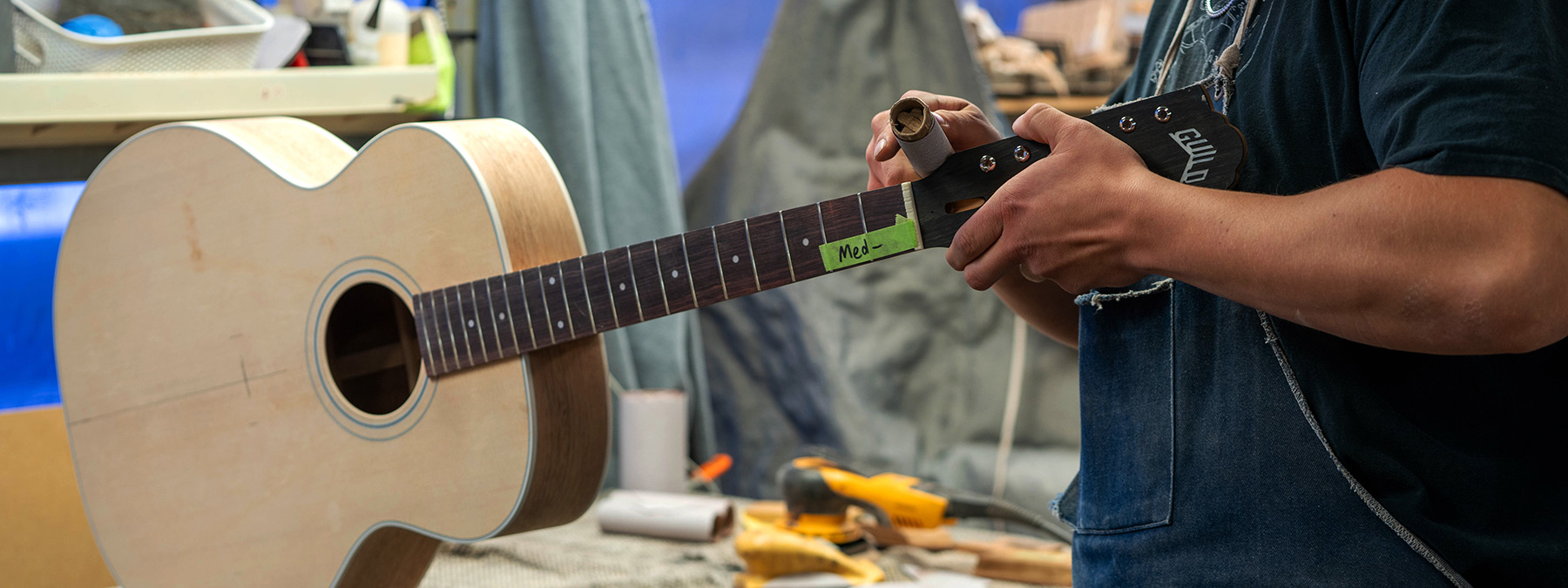 A craftsman making a guitar, Guild blog header image