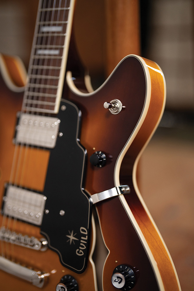 Close-up of the fingerboard and pickup selector switch on a Starfire Deluxe DC Sweet Tea, showing the block inlays and ivory binding.