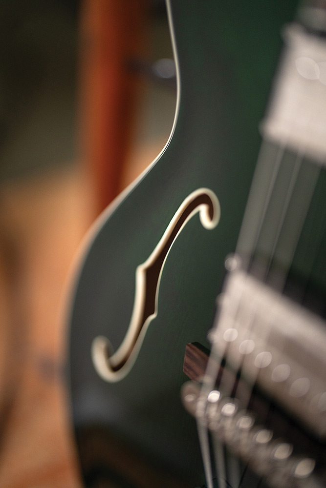 Close-up of the F-hole on a Starfire Deluxe DC GVT Emerald Green, showing the ivory binding.