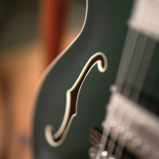 Close-up of the F-hole on a Starfire Deluxe DC GVT Emerald Green, showing the ivory binding.
