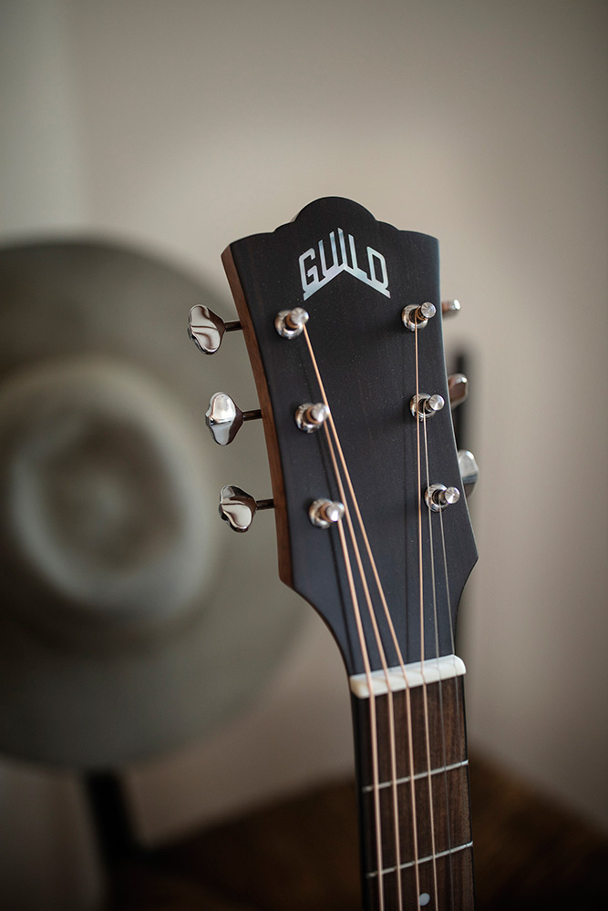 Close-up M-240E headstock with Guild logo