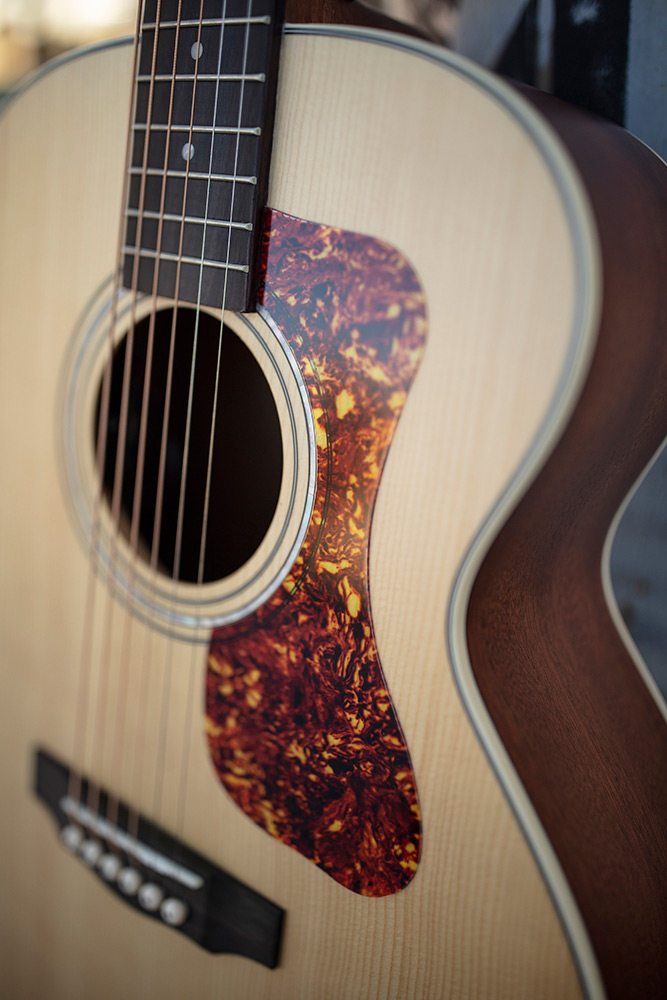 Close-up of Jumbo Junior Mahogany pickguard