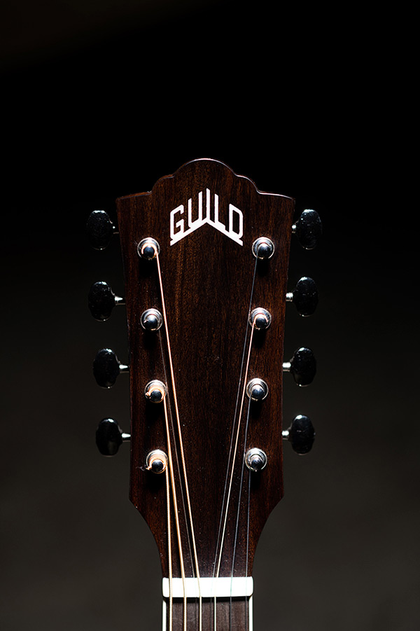 Close-up BT-258E Deluxe Baritone Natural Arched headstock with Guild logo