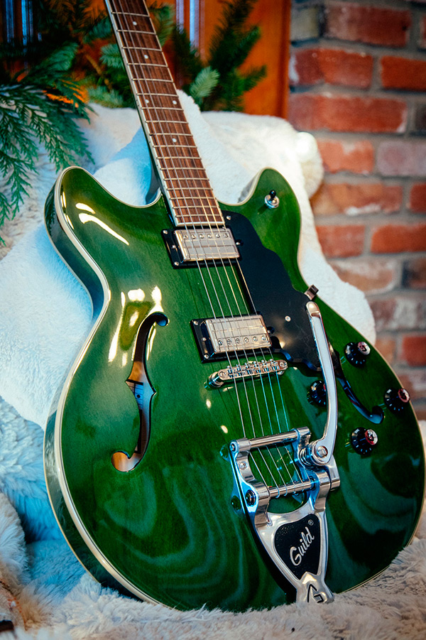 Thumbnail view of Starfire I DC Emerald Green body leaning against a fluffy white chair in a cabin