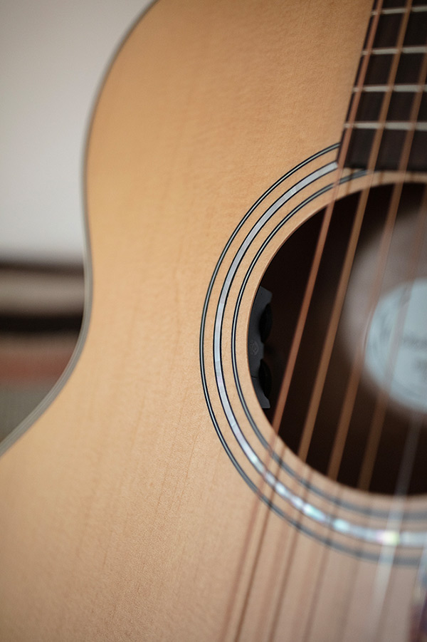 Close-up of OM-240E Natural soundhole and rosette
