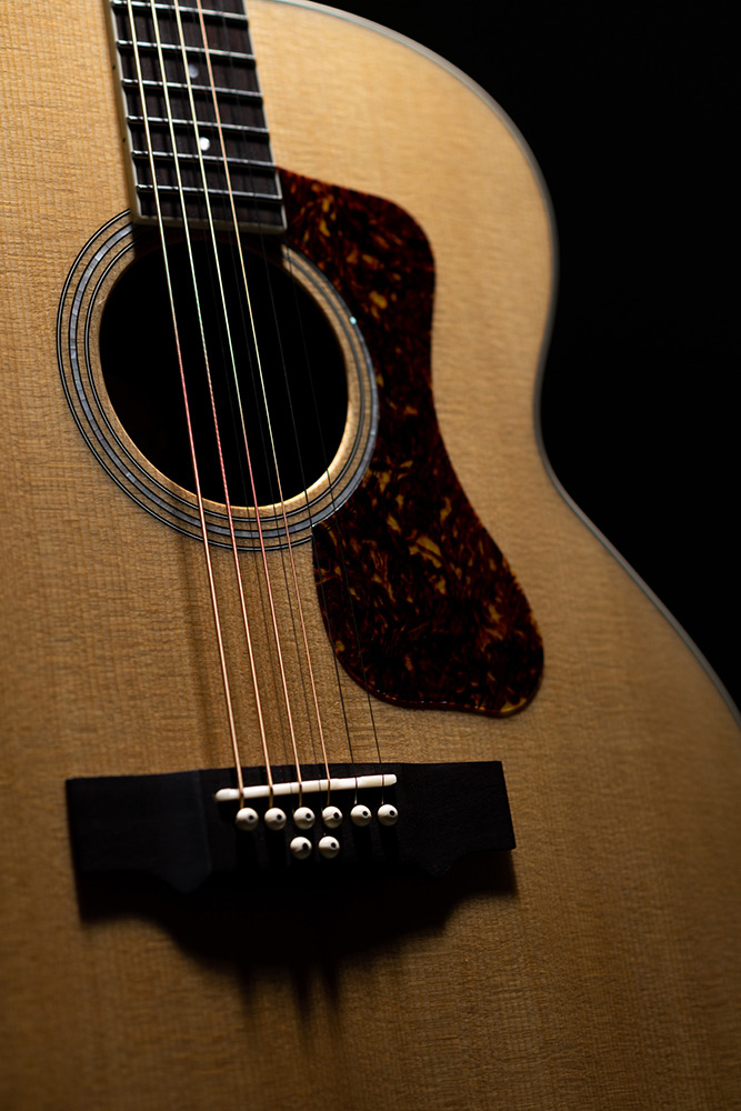 Close-up BT-258E Deluxe Baritone Natural Arched Rosewood showing soundhole, pickguard, and bridge