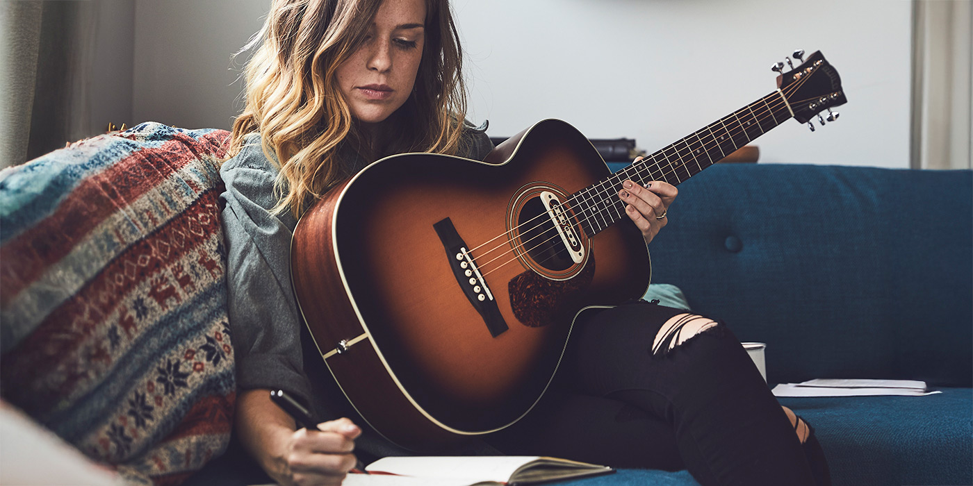 M-240E Natural leaning against a wicker chair