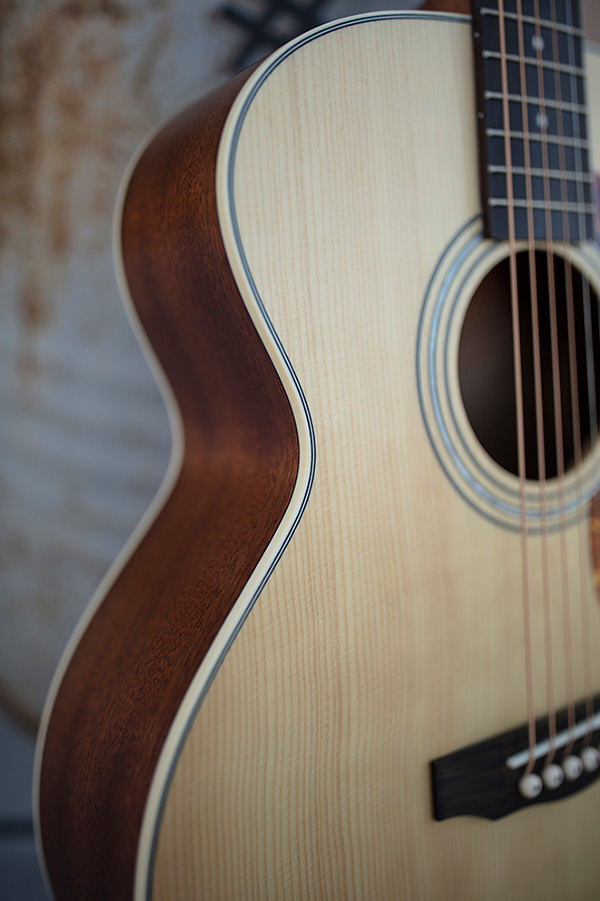 Close-up of Jumbo Junior Mahogany body showing binding and mahogany side