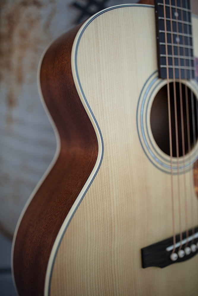 Close-up of Jumbo Junior Mahogany body showing binding and mahogany side
