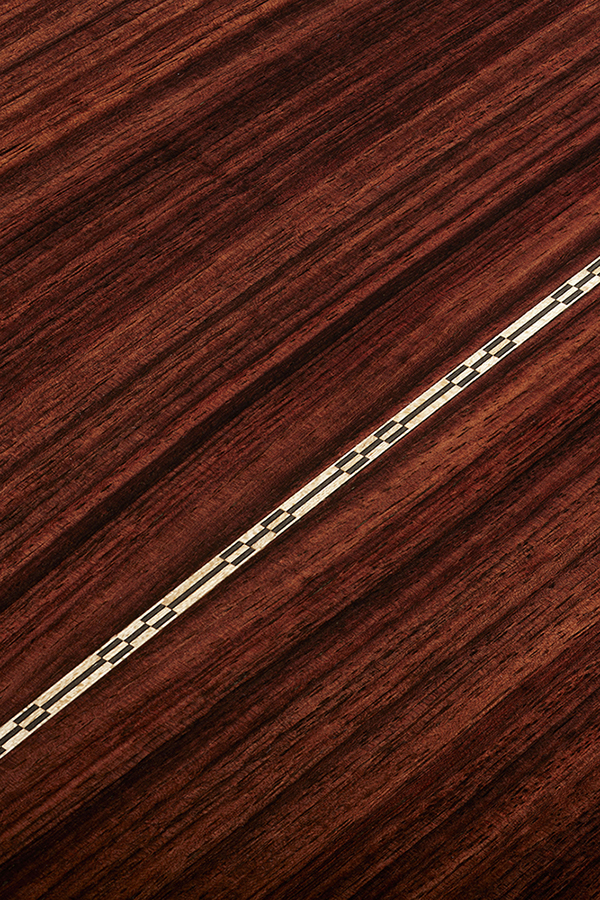 Close-up of F-512E Antique Burst showcasing the back wood grain and inlay