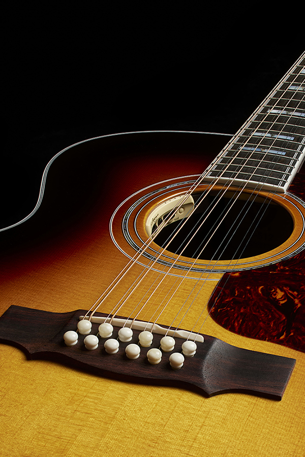 Top down look at the body of F-512E Antique Burst acoustic guitar