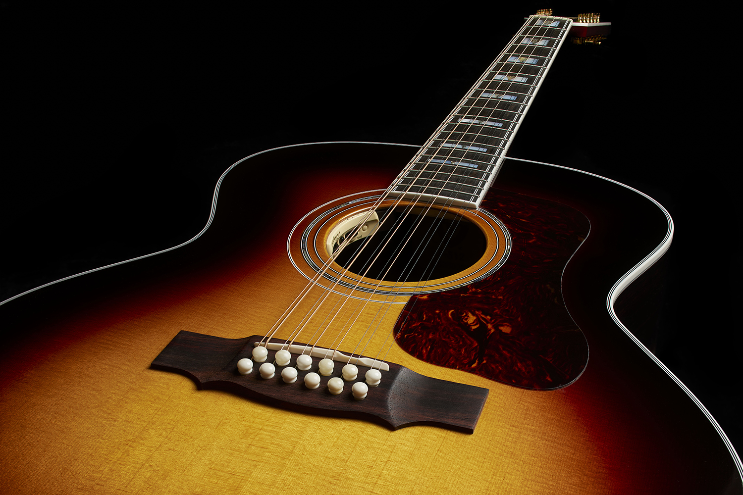 Top down look at the body of F-512E Antique Burst acoustic guitar