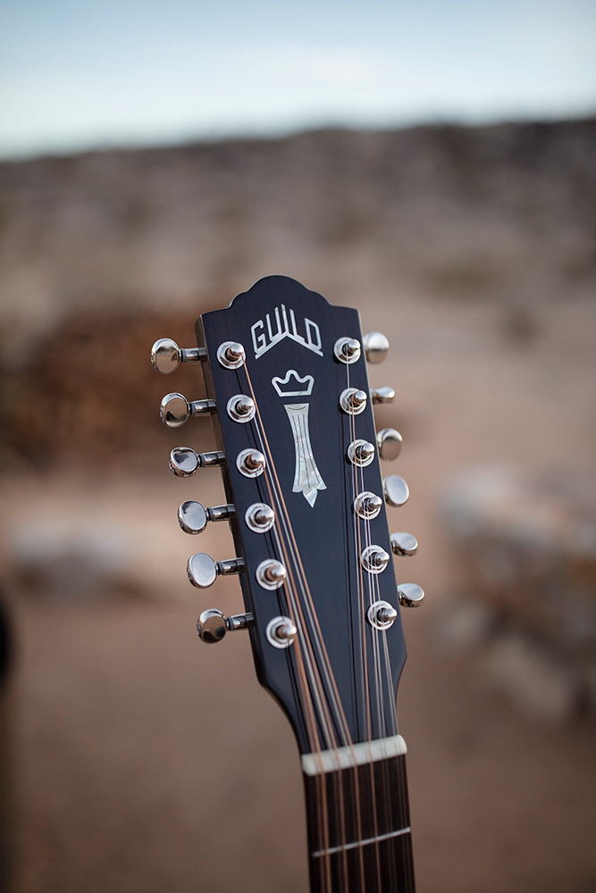 Close up of F-1512 headstock showing tuners and Guild Peak logo