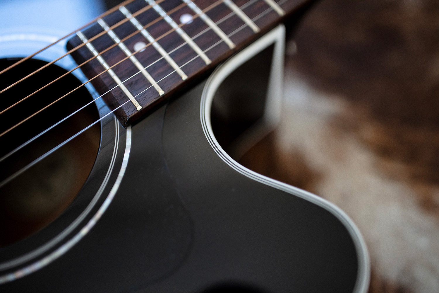 Close up of D-140CE Black body top featuring shoulder curve