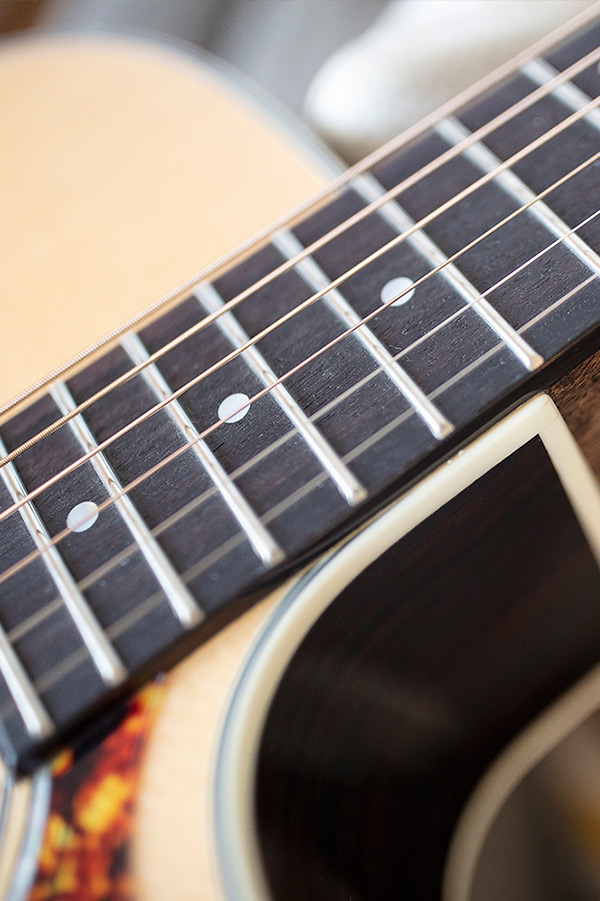 Close up of OM-150CE Natural neck and strings thumbnail