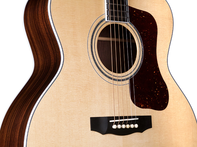 Horizontal body close-up view of F-55 natural guitar