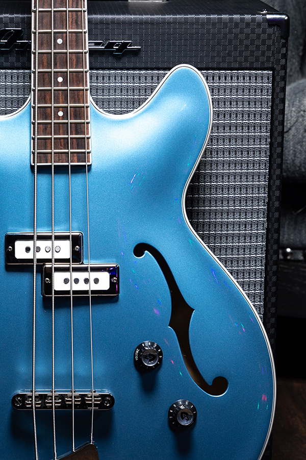 Starfire I Pelham Blue bass body leaning against an Ampeg Amp thumb