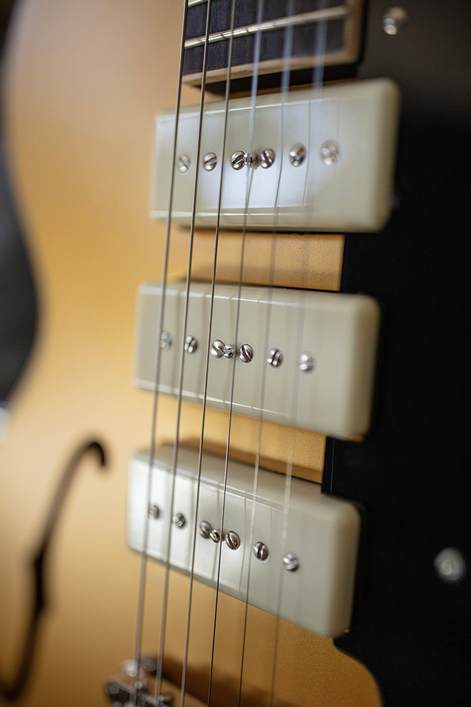 Close-up view of Starfire I Jet90 Satin Gold pickups
