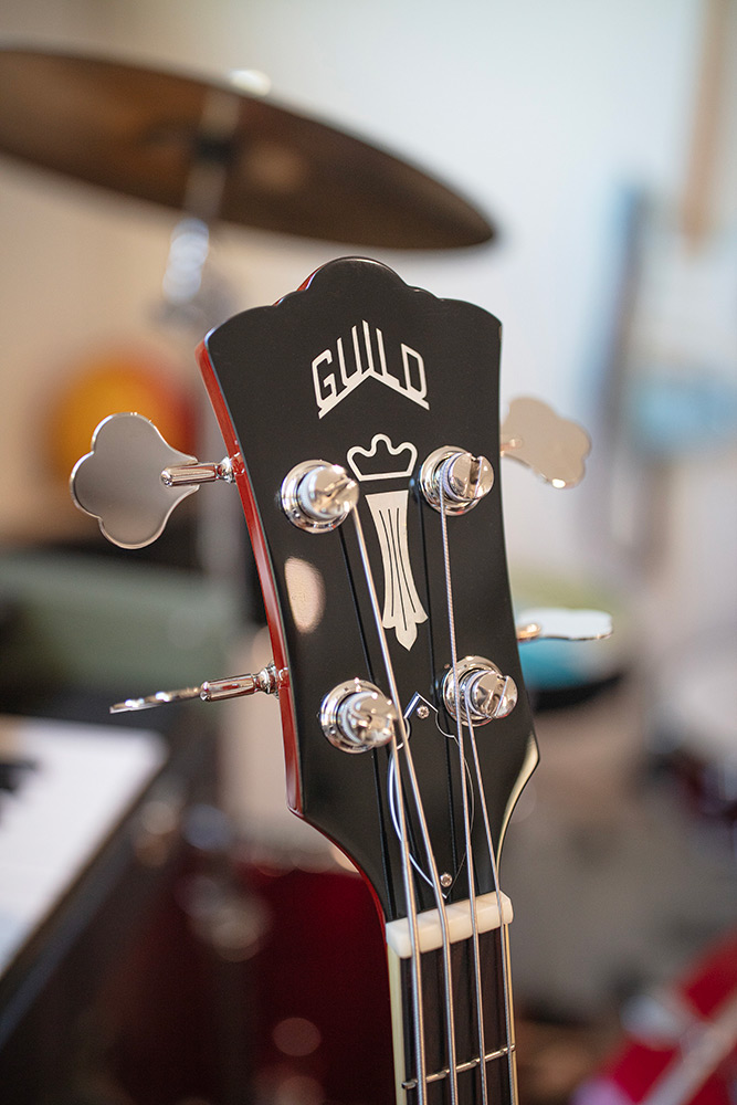 Close-up of Starfire II bass headstock with Guild logo