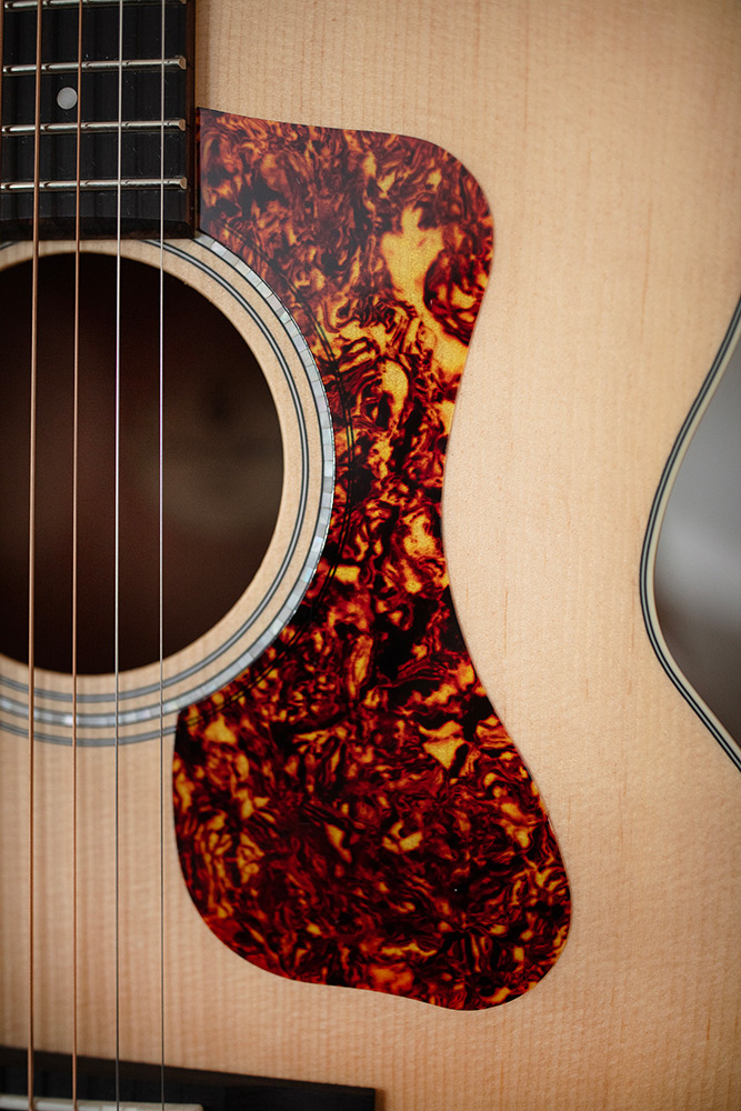Close up of BT-240E Baritone Natural soundhole and pickguard