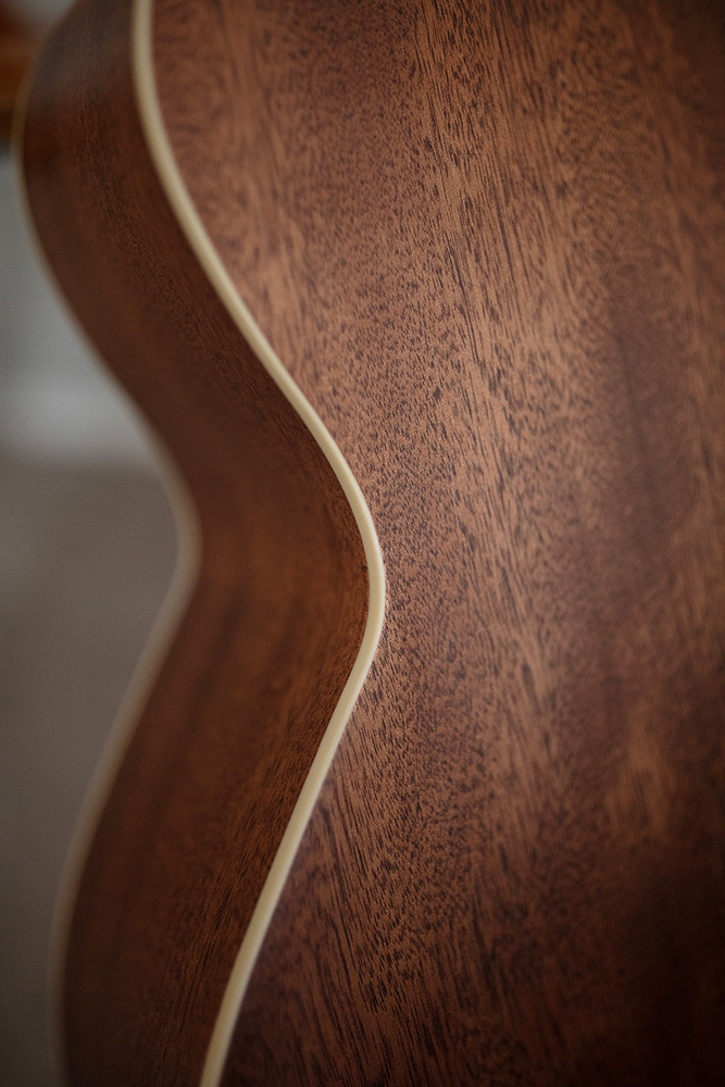 Close up of BT-240E Baritone Natural arched mahogany back and mahogany side