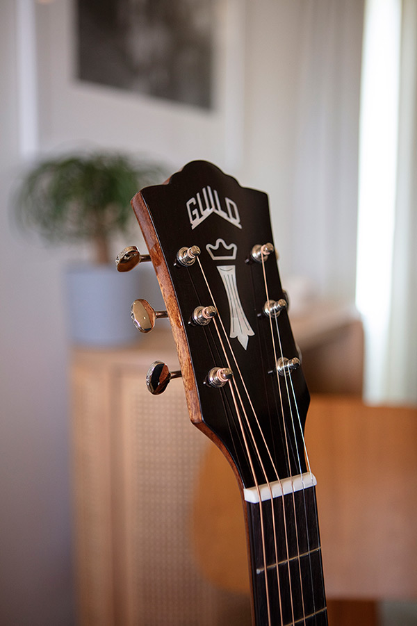 Close up of OM-120 headstock featuring Guild Peak Logo thumbnail
