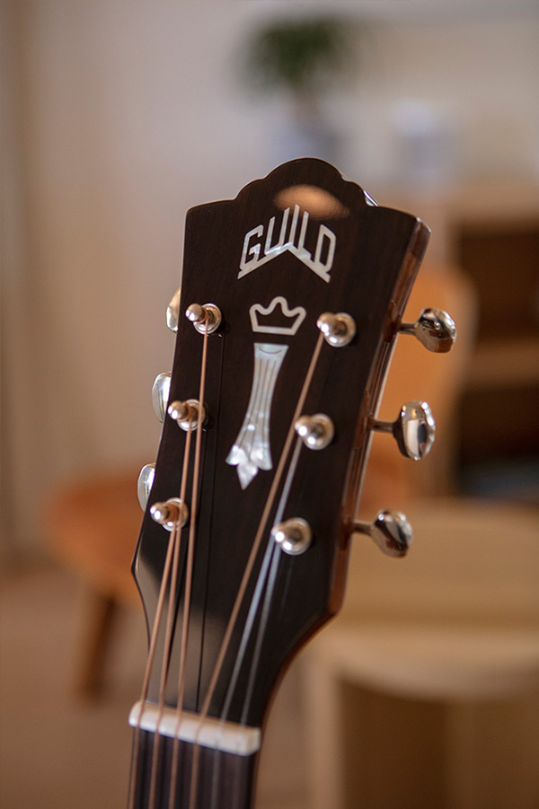 Close up of D-120 headstock with Guild Peak logo thumbnail