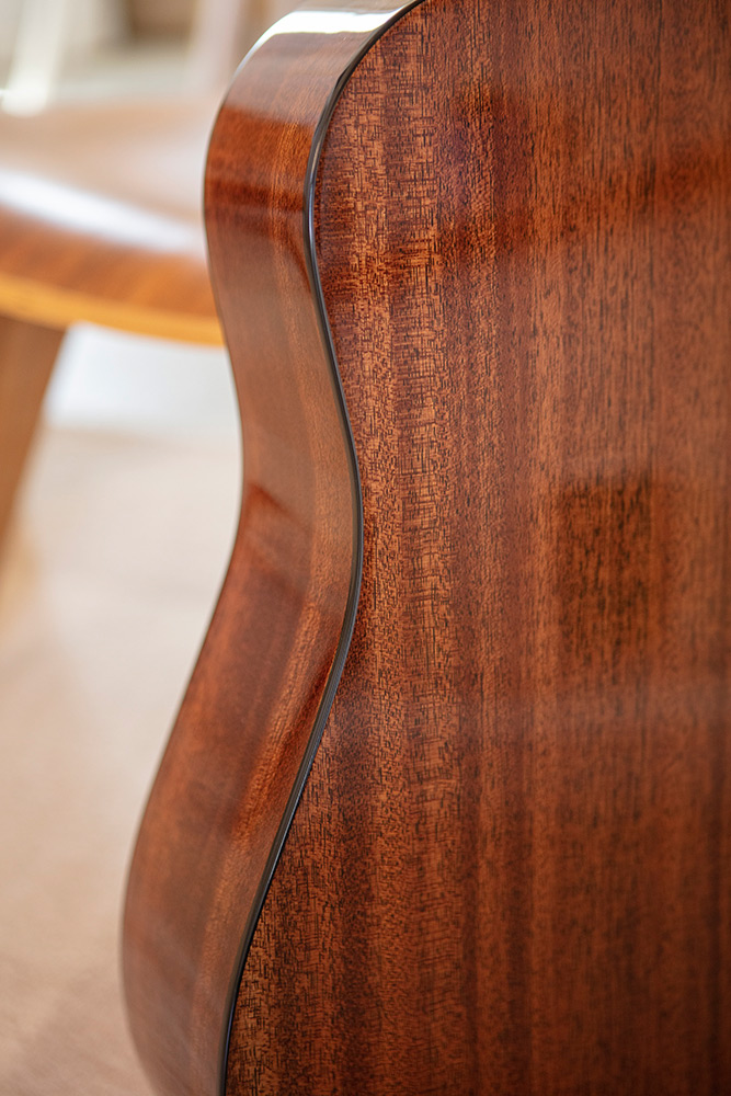 Close up of D-120 back and side curve showcasing Solid African Mahogany