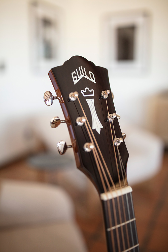 Close up of D-140 headstock with Guild Peak logo