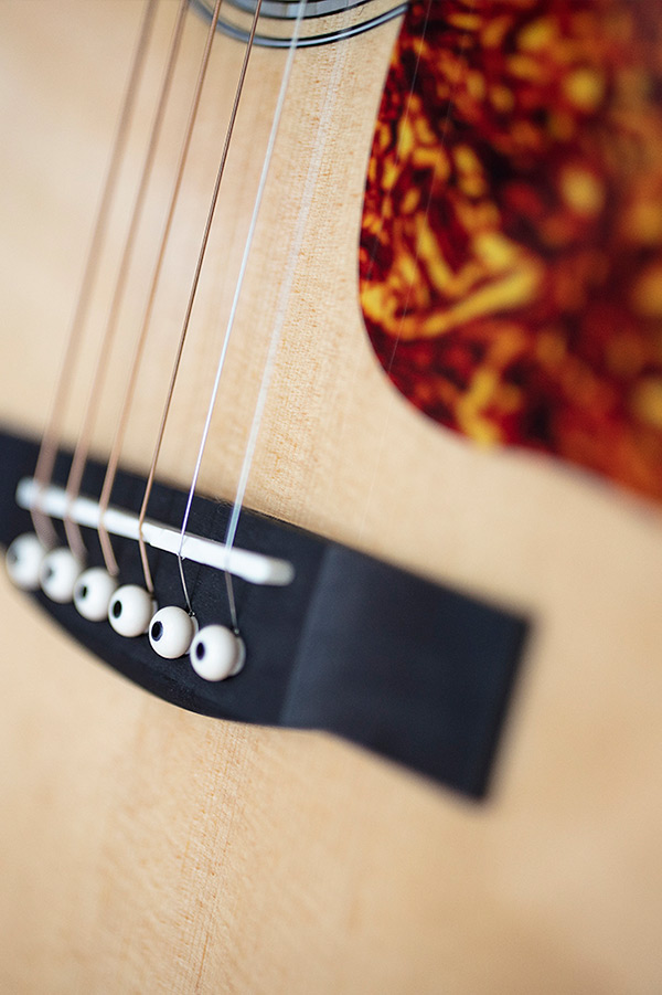 Close up of OM-150CE Natural bridge thumbnail