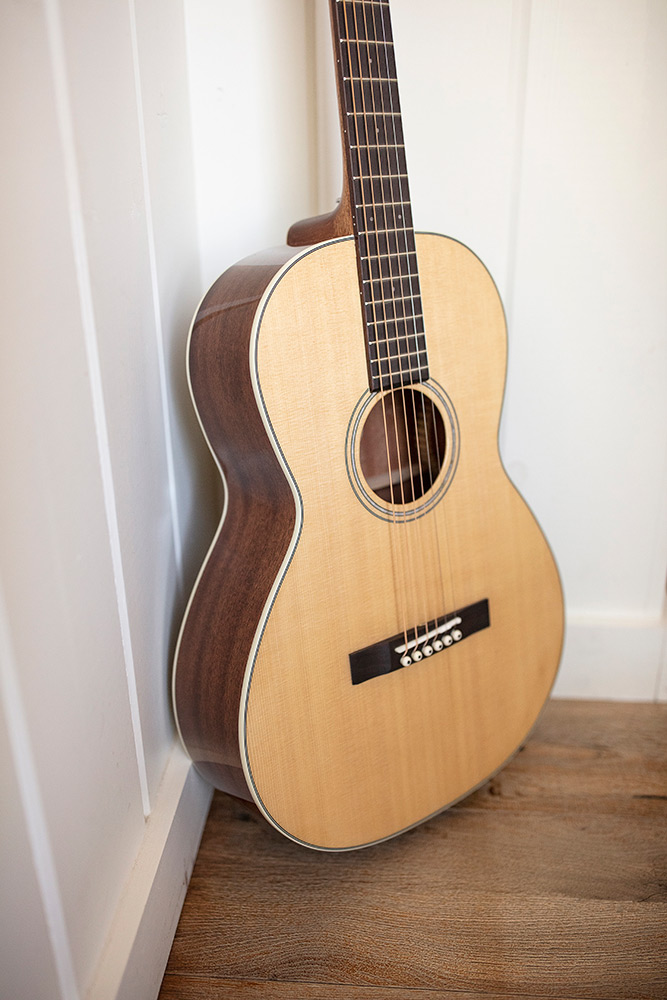 P-240 Memoir body of guitar leaning against corner of a room