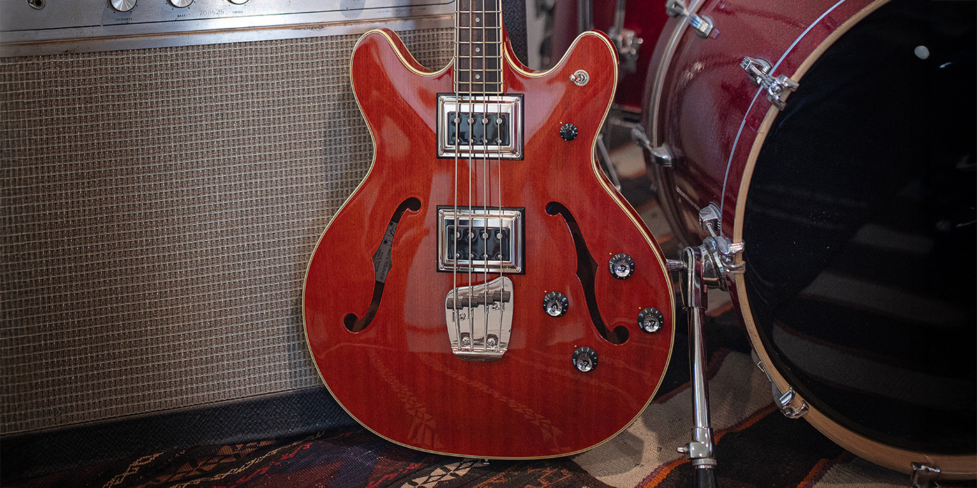 Starfire II Bass leaning against an amp and bass drum