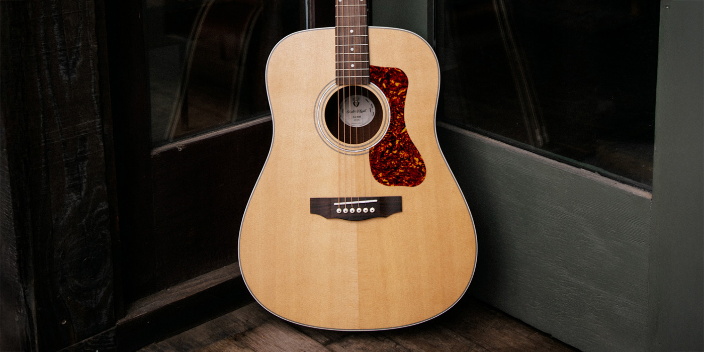 D-240E Natural in front of a dark wood fence