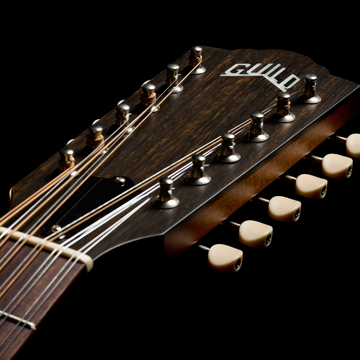 Close-up of the F-412 Standard Pacific Sunset Burst headstock thumb