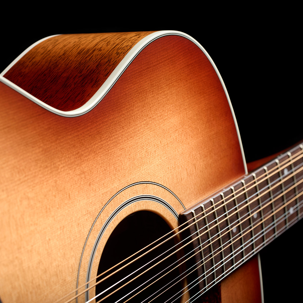 Close-up of F-412 Standard Pacific Sunset Burst body side curve thumb