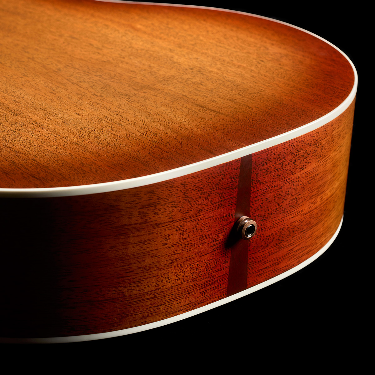 Close-up of F-412 Standard Pacific Sunset Burst strap pin thumb