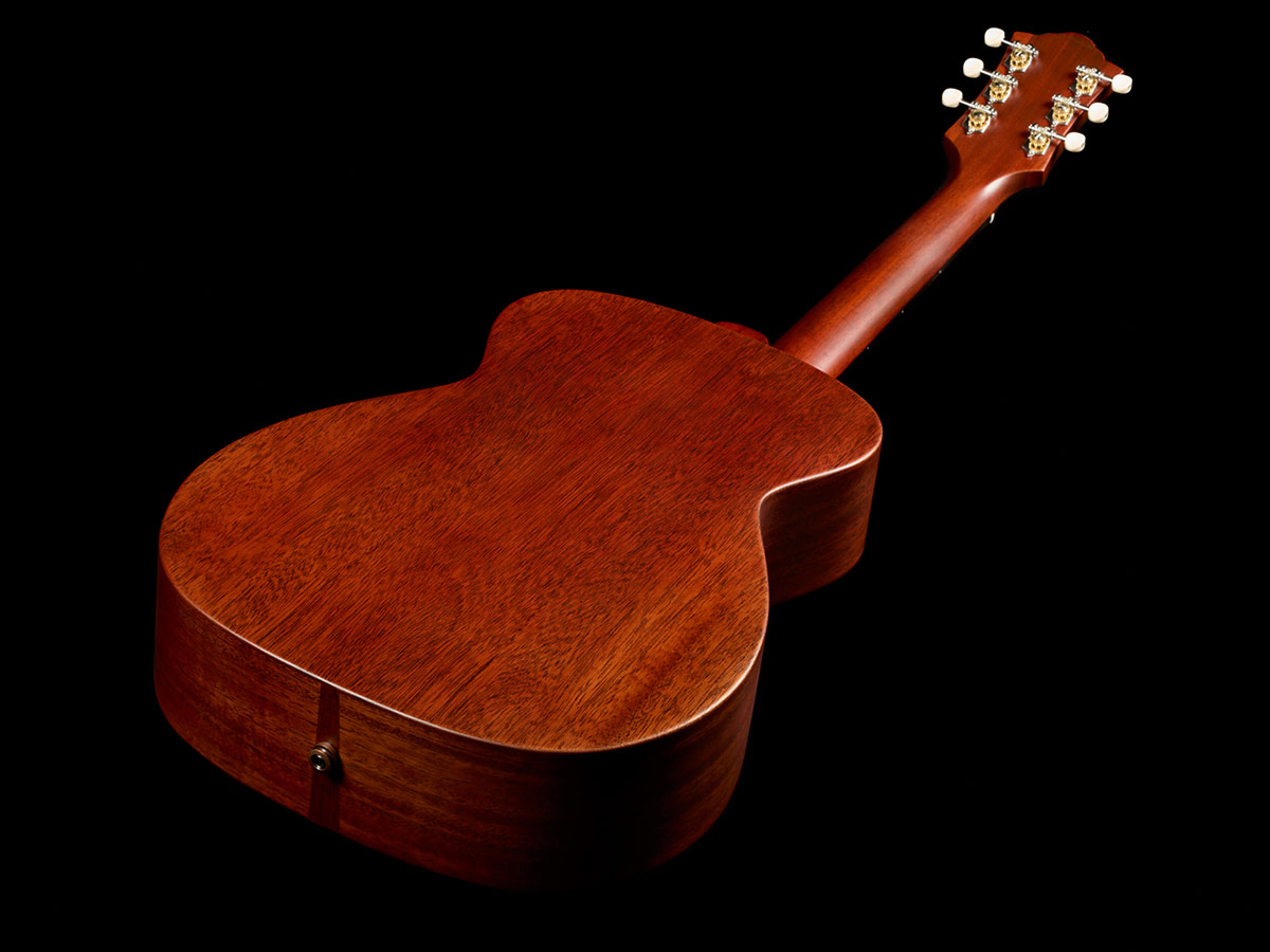 Top down back view of M-20 Natural acoustic guitar showcasing solid African mahogany back