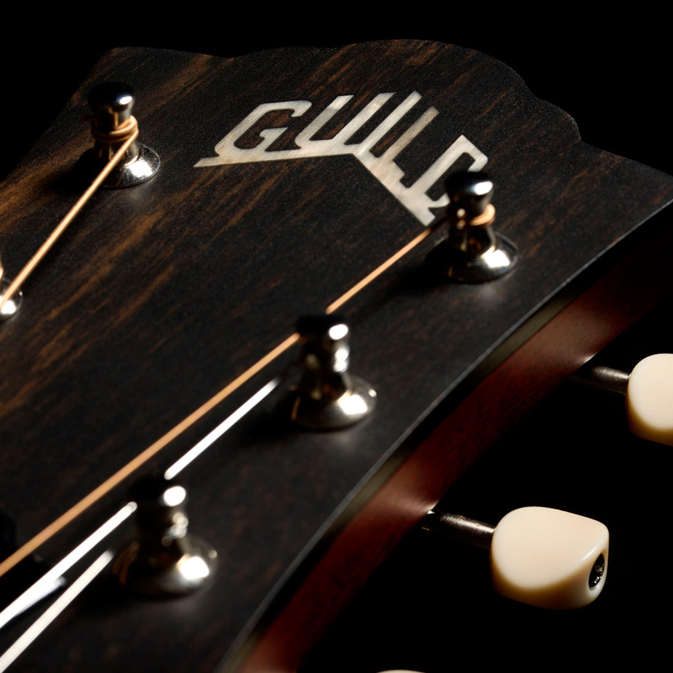Close-up of the front of the M-20 Natural headstock thumb