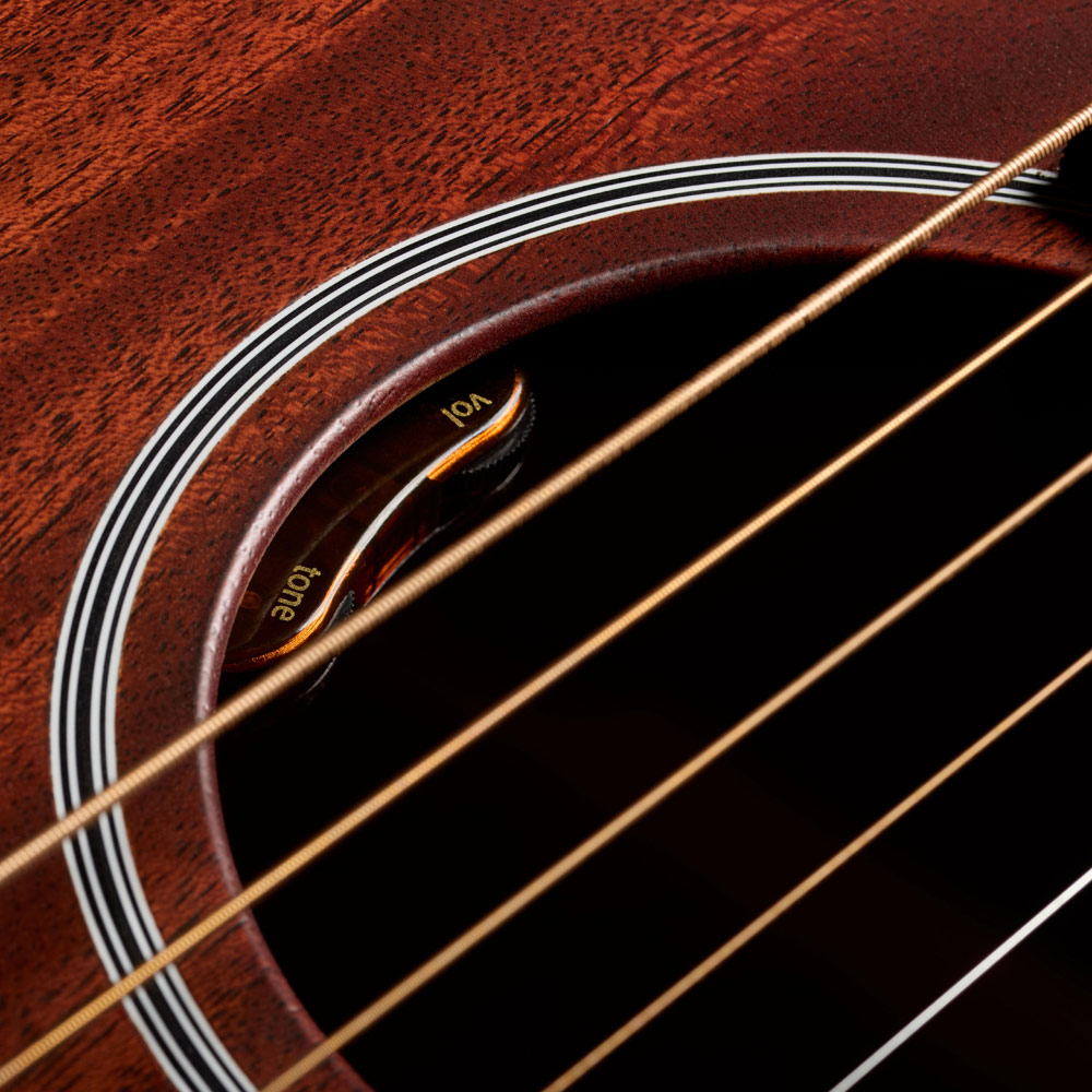 Close-up of M-20E Natural soundhole featuring L.R. Baggs Element VTC pickup system thumb