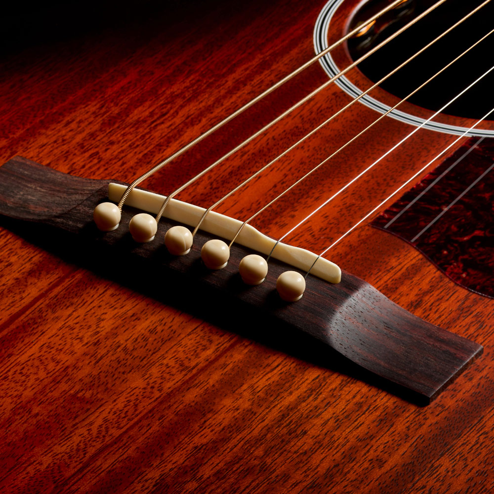 Close-up of M-20E Vintage Sunburst bridge thumb