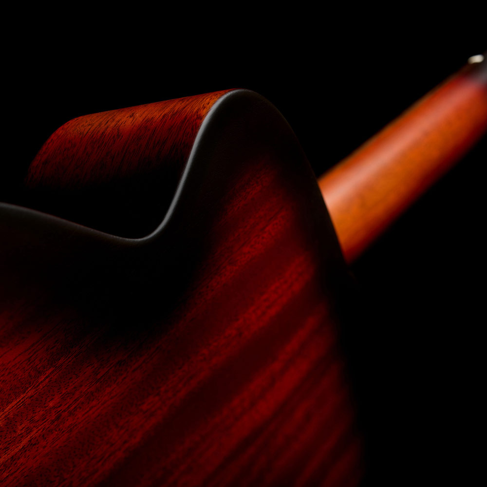 Close-up of M-20 Vintage Sunburst body back curved shoulder thumb