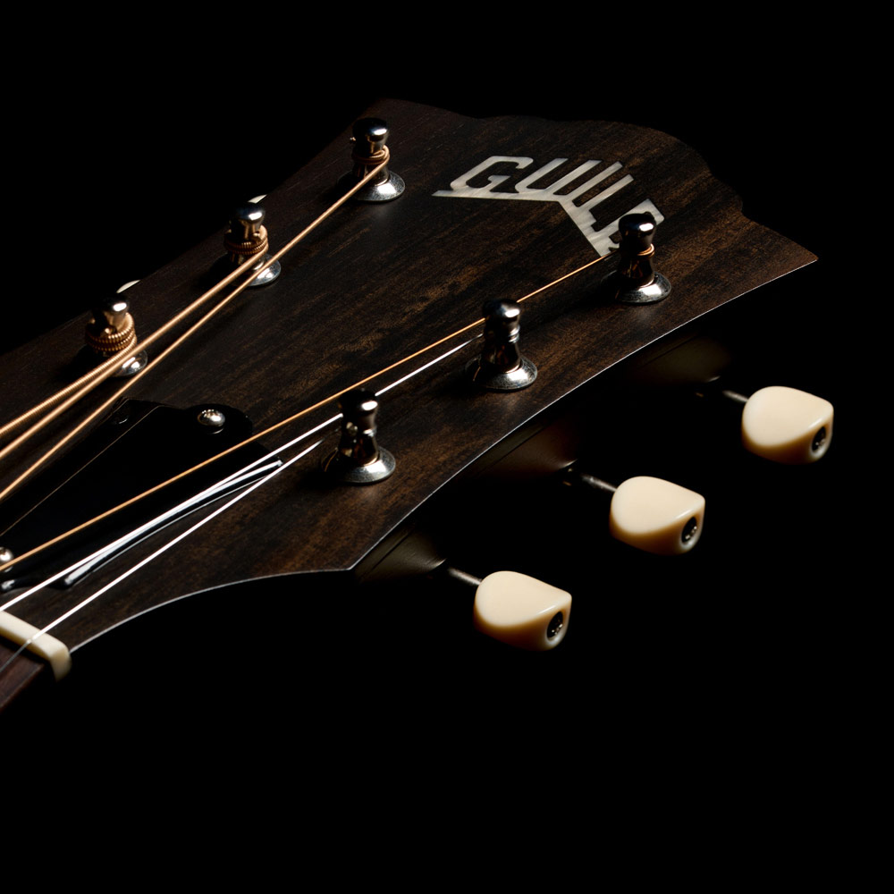 Close-up of the front of the M-20 Vintage Sunburst headstock thumb