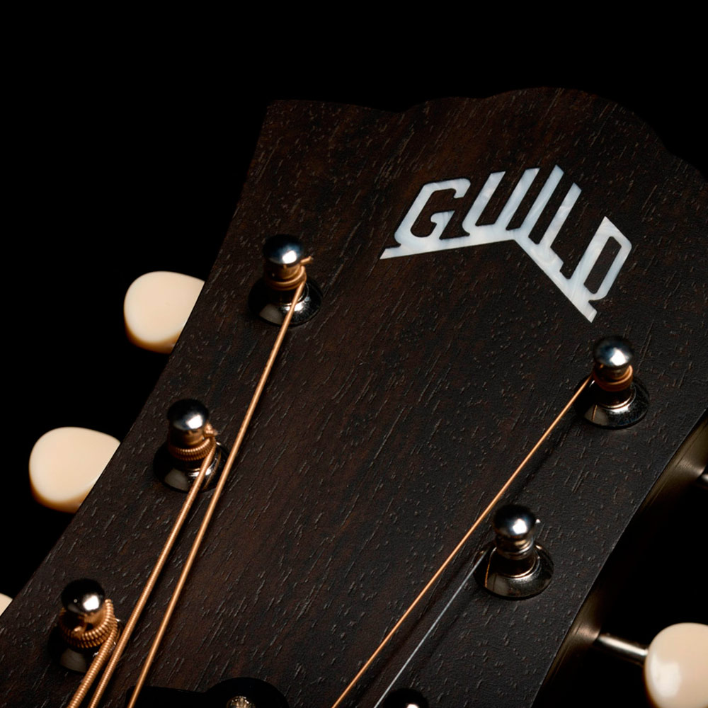 Close-up of the front of the D-20 Vintage Sunburst headstock thumb