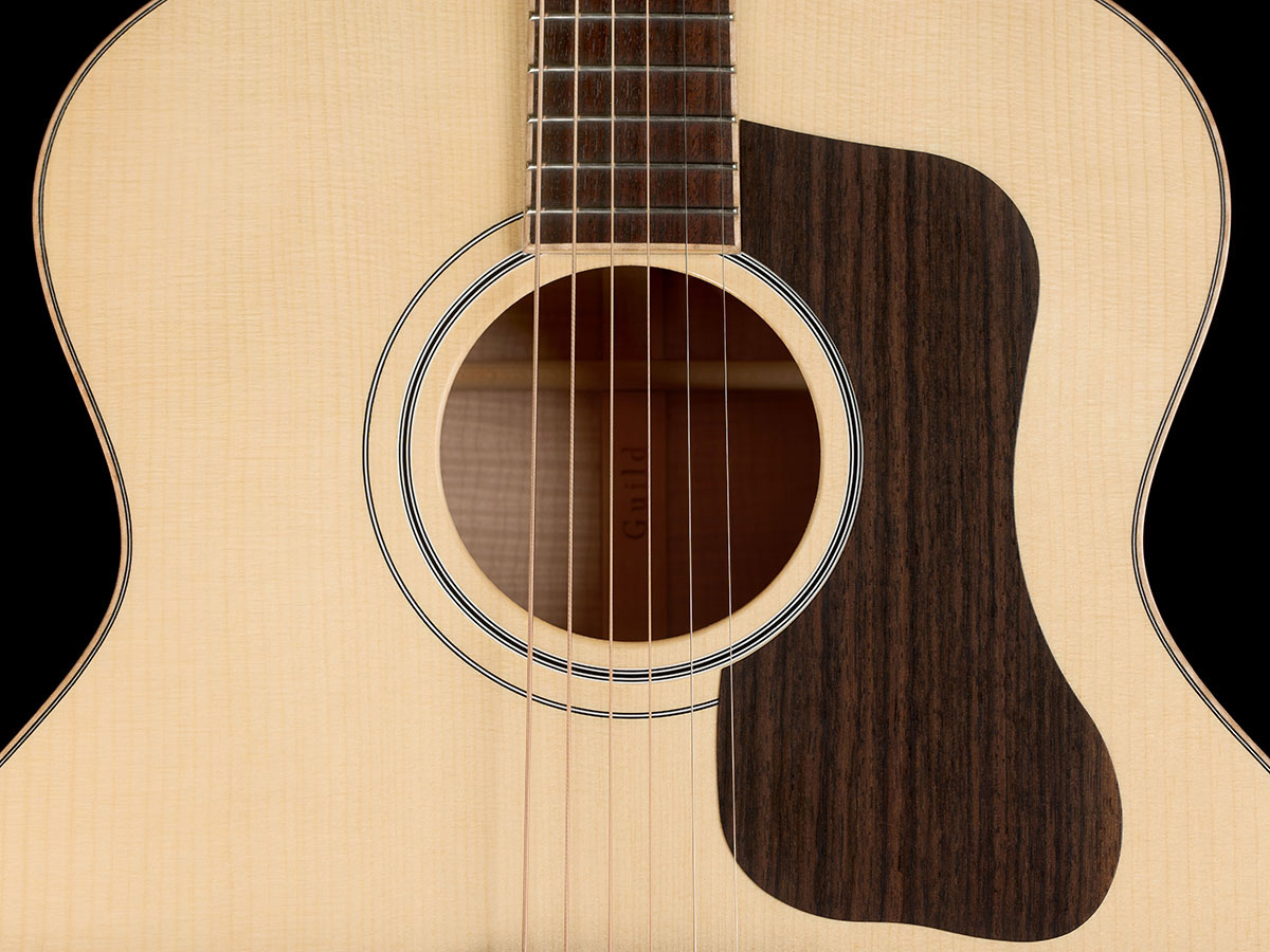 Close-up of VR1 F-40 Au Naturel guitar’s front body showcasing the ultra-rare aged solid 5A Adirondack spruce top