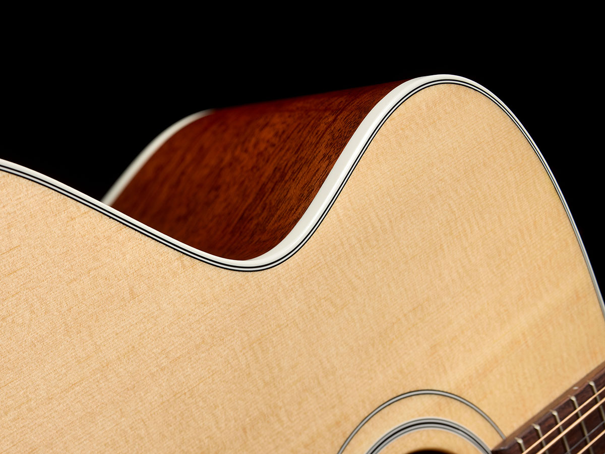 Close-up of The F-412 Standard Natural side curve showcasing solid Sitka spruce top and solid African mahogany sides