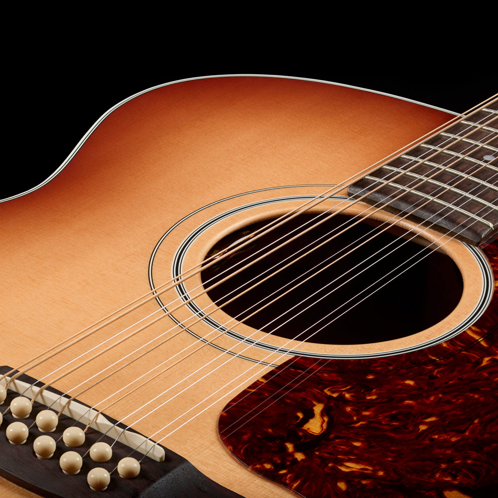 Top down view of F-412 Standard Pacific Sunset Burst soundhole and bridge thumb