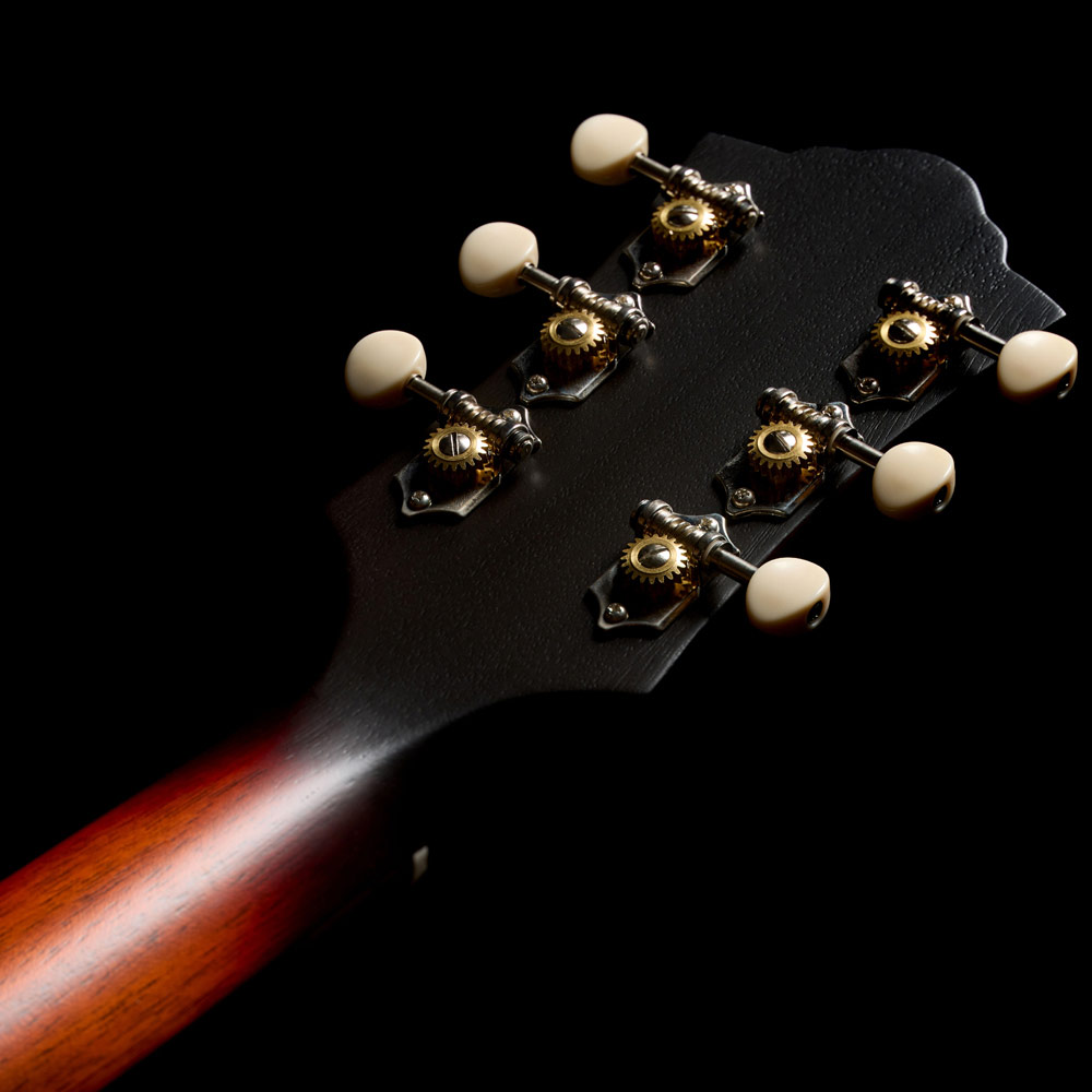 Close-up of the back of the M-20 Vintage Sunburst headstock thumb