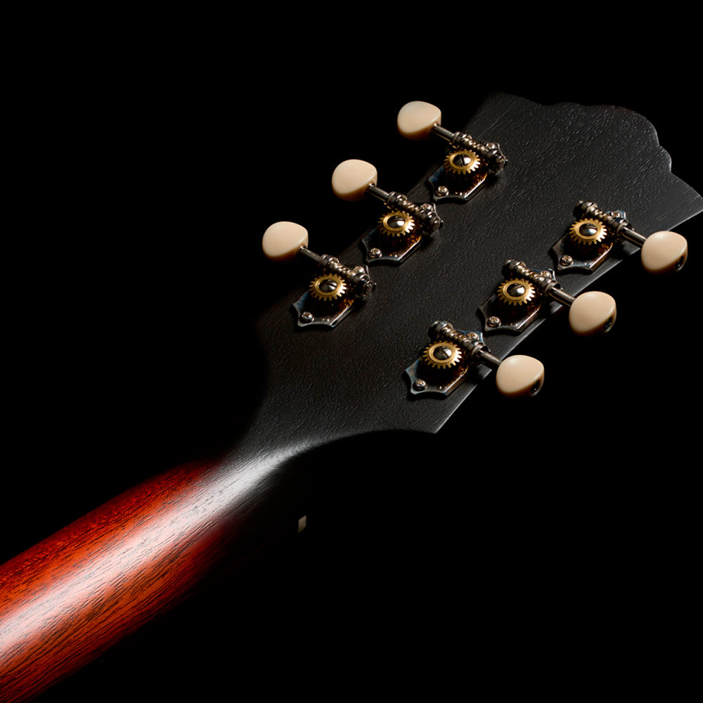 Close-up of the back of the D-20 Vintage Sunburst headstock thumb