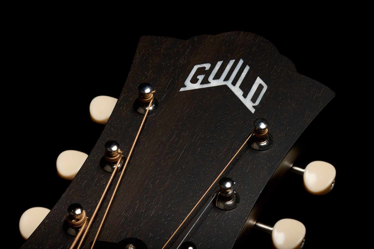 Close-up of the front of the D-20 Vintage Sunburst headstock