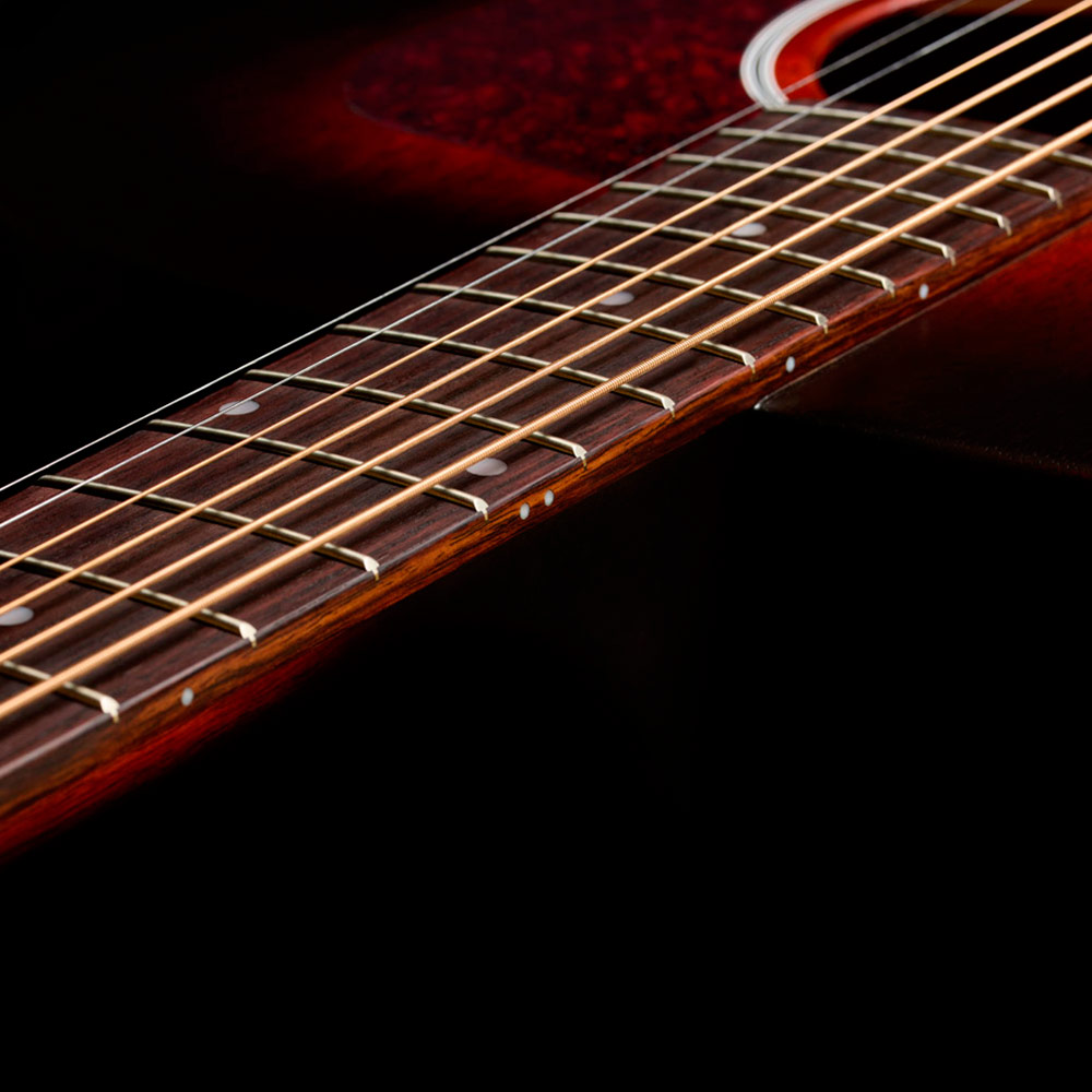 Close-up of D-20 Vintage Sunburst neck and strings thumb